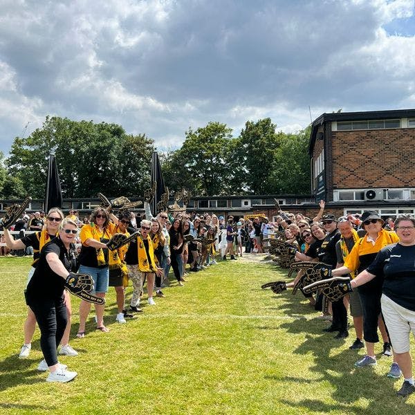 Wasps FC fans give the Wasps Women team a guard of honour showing the community spirit at Twyford Avenue