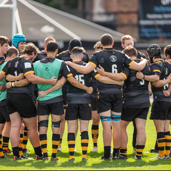 A Wasps FC team huddle before a match showing their team ethic at Twyford Avenue