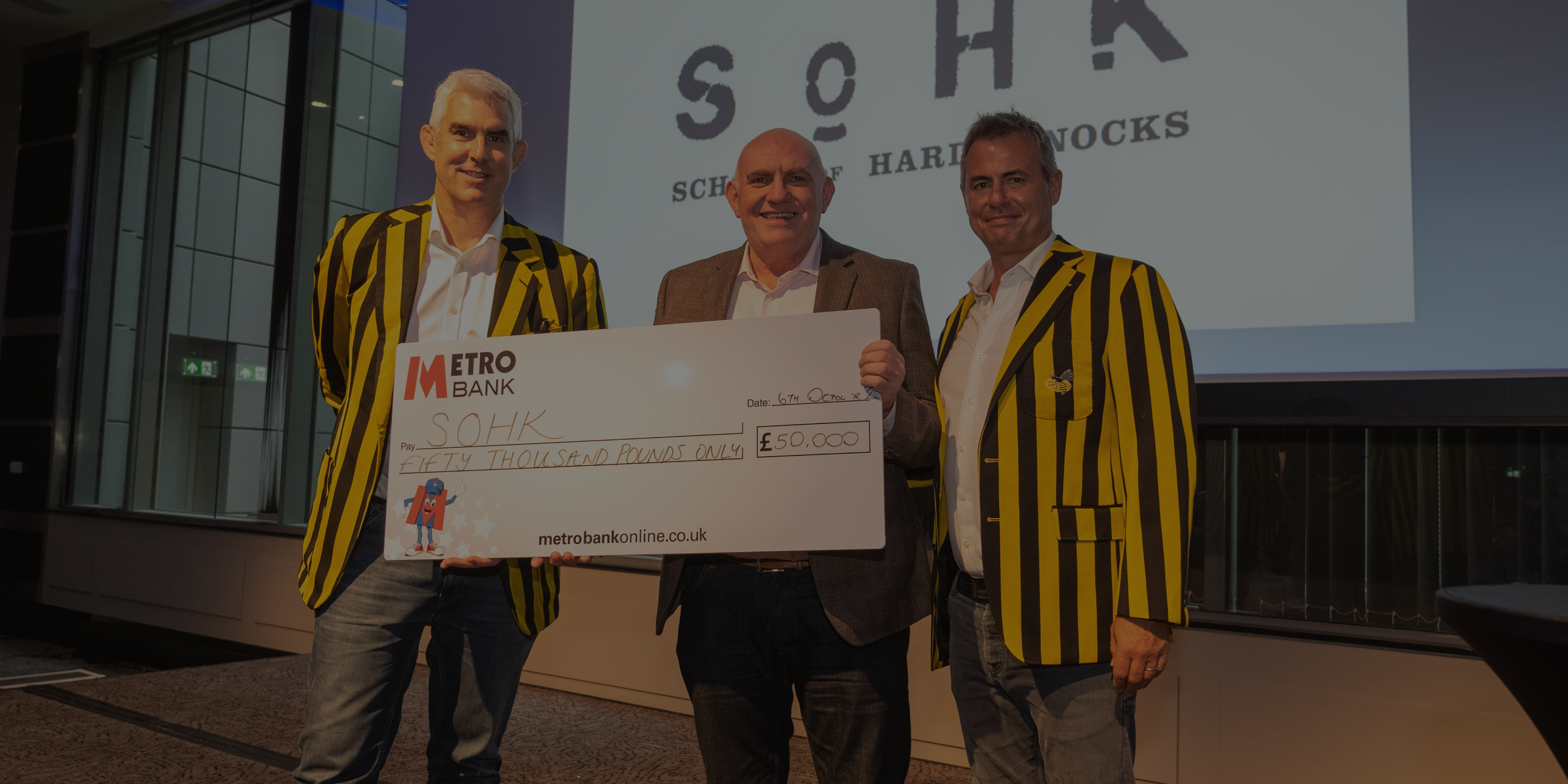 School of Hard Knocks Ken Cowen with Wasps Legends Chris Braithwaite and Peter Scrivener who present him with our main grant cheque at the Long Lunch 2022